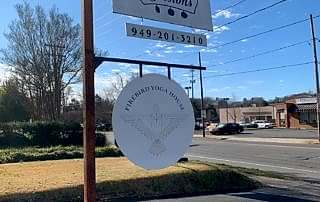 Firebird Yoga House Streetside Sign